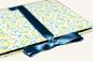 Preview: Leporello open with light pages, yellow flower cover and yellow satin bow